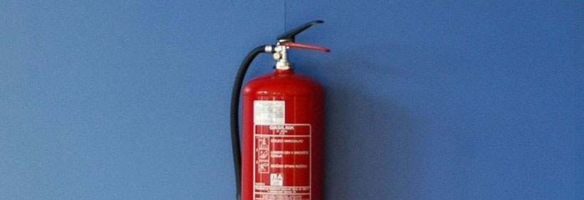 fire extinguisher hanging on a wall
